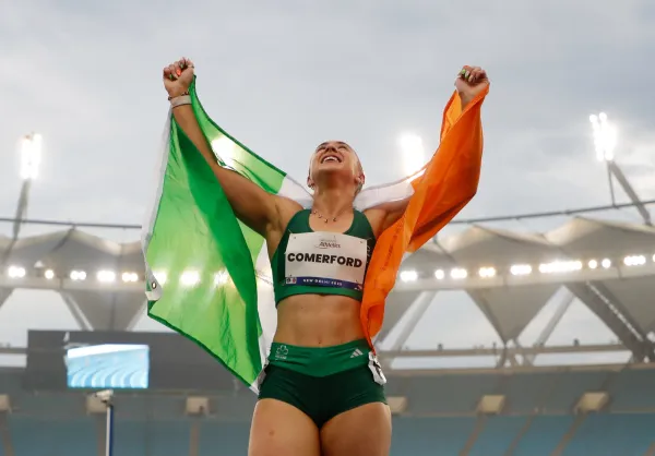 Photo of Orla Comerford celebrating with Irish Flag