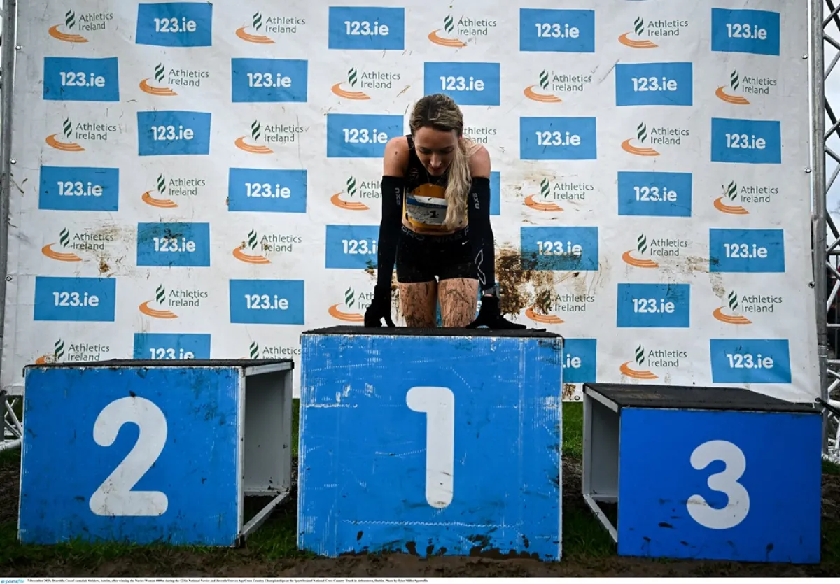 Photo of female winner on podium at 2025 novice cross country